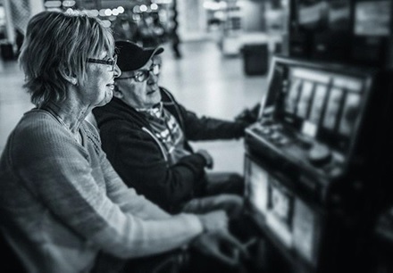 Older Couple at a slot machine